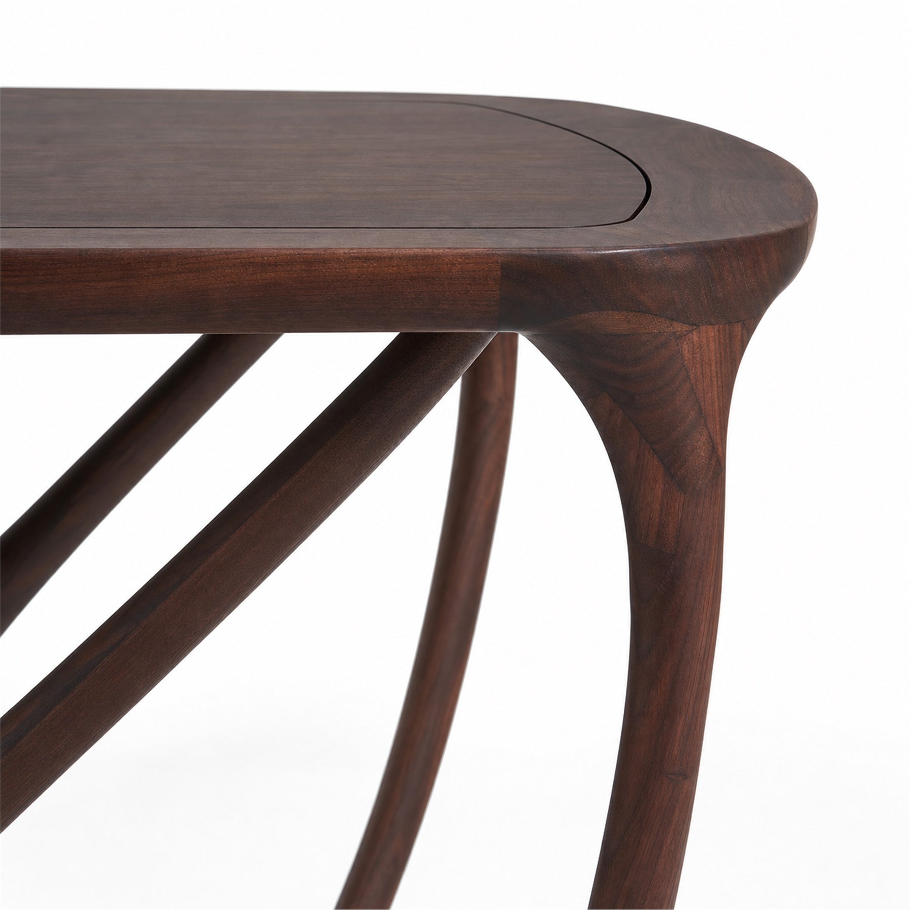 black walnut dining table with a close up of the rounded top and branching legs.