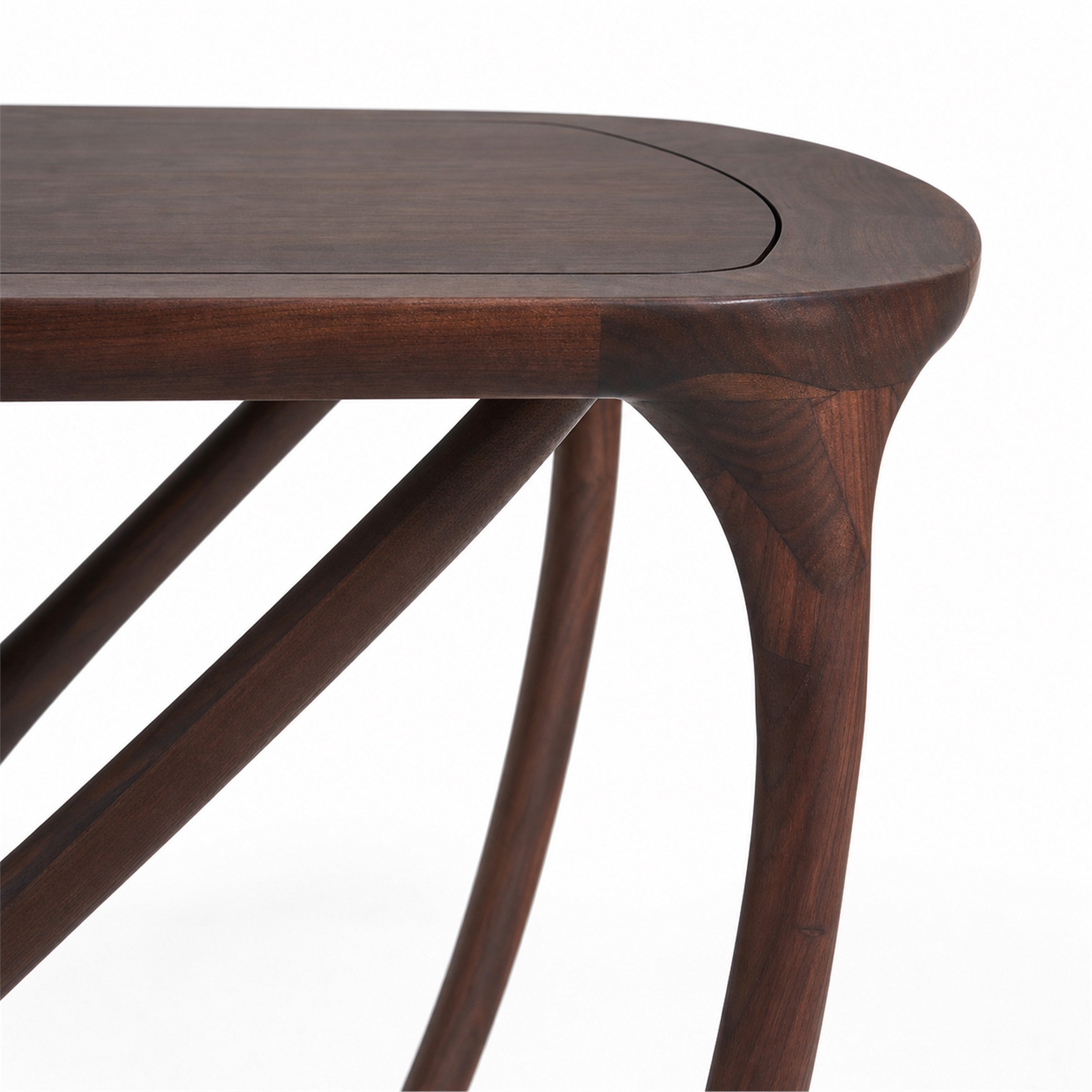 black walnut dining table with a close up of the rounded top and branching legs.