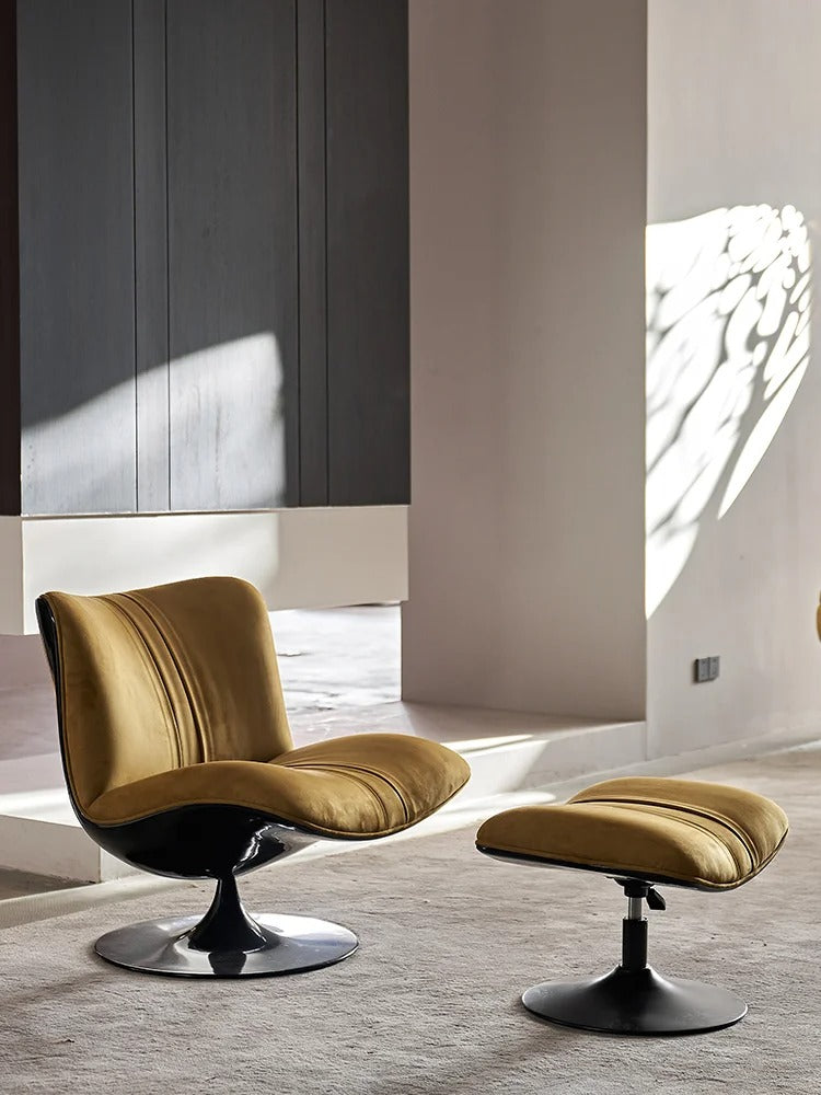 Lotus nubuck leather lounge chair in ochre with curved backrest and black swivel pedestal base and foot rest