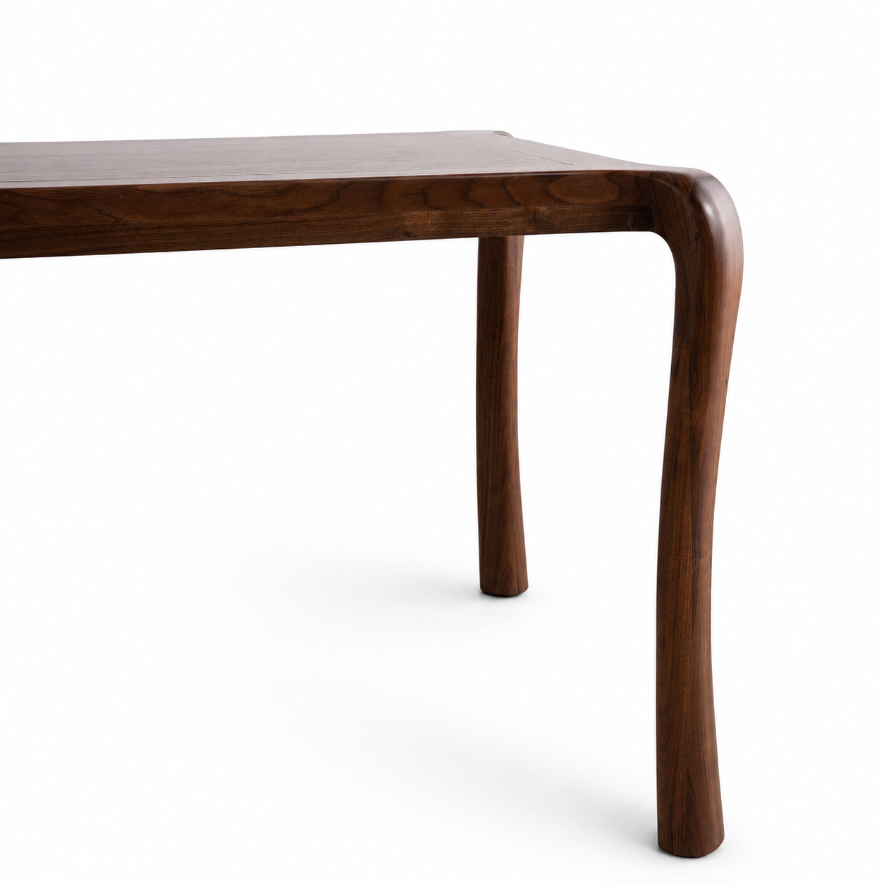 Close-up of a dark brown wooden table leg with a curved, sculptural silhouette against a clean white background.