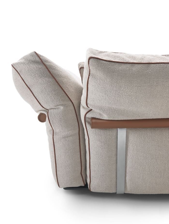 Arthur Modular Sofa side detail with layered cushions, contrast piping and exposed metal support