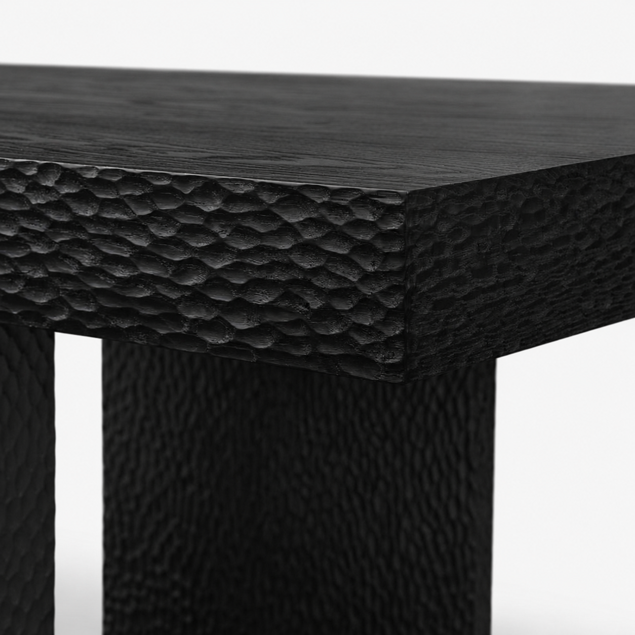 Black textured table on a white background