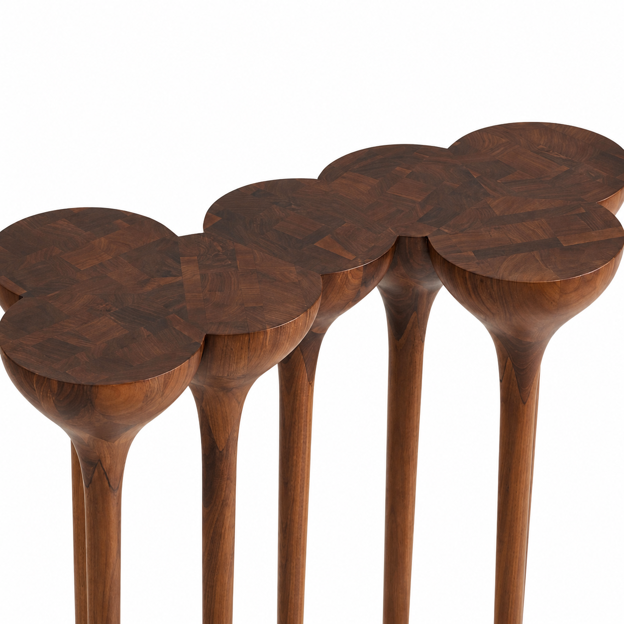 A set of four modern nesting side tables made of dark brown wood, featuring circular tops with a parquetry pattern and tapered legs