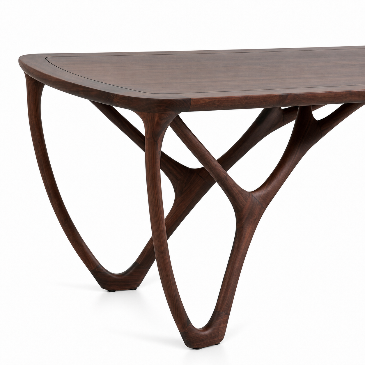 black walnut dining table with a close up of the organic branching base, rounded top.