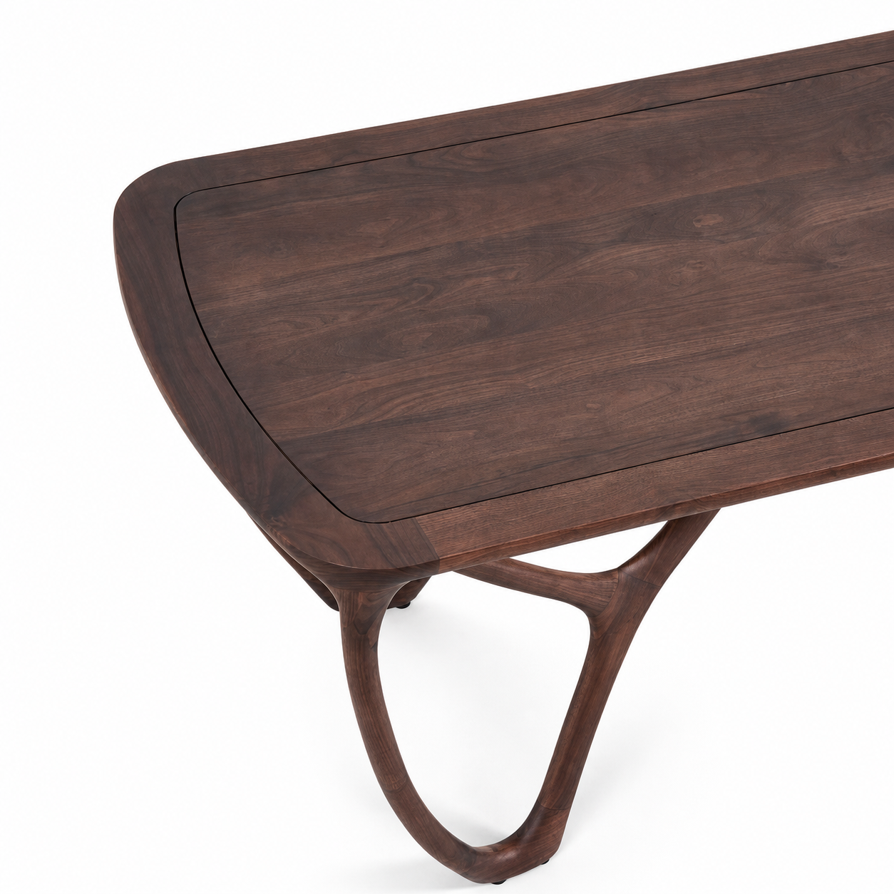 black walnut dining table birds eye view with grained top detail.