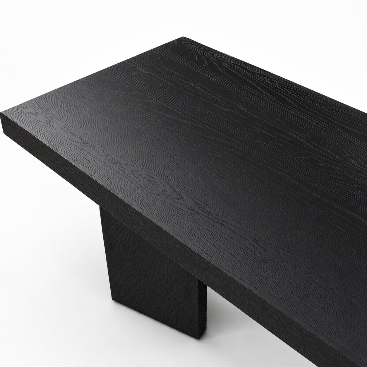 Black wooden table with natural grain on a white background