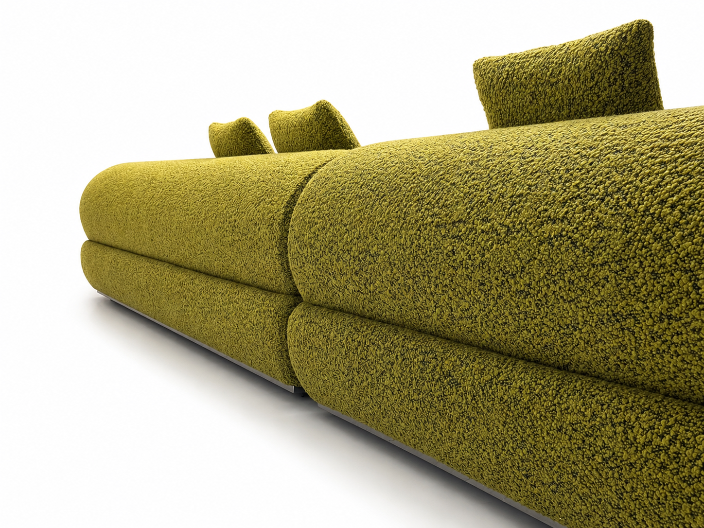 A close-up studio shot of the modern Nocturne sectional sofa upholstered in a textured, looped fabric in an olive green color, featuring a low profile and matching back cushions on a white background.