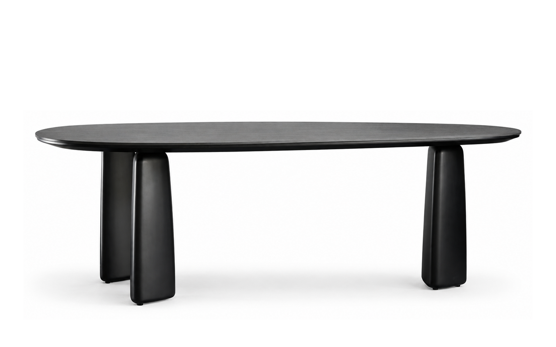 Black sintered stone dining table with elongated oval top and rounded lacquered pedestal legs
