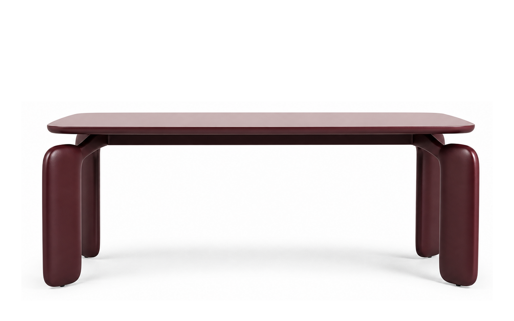 Lacquered timber dining table in deep burgundy with rounded rectangular top and broad curved legs