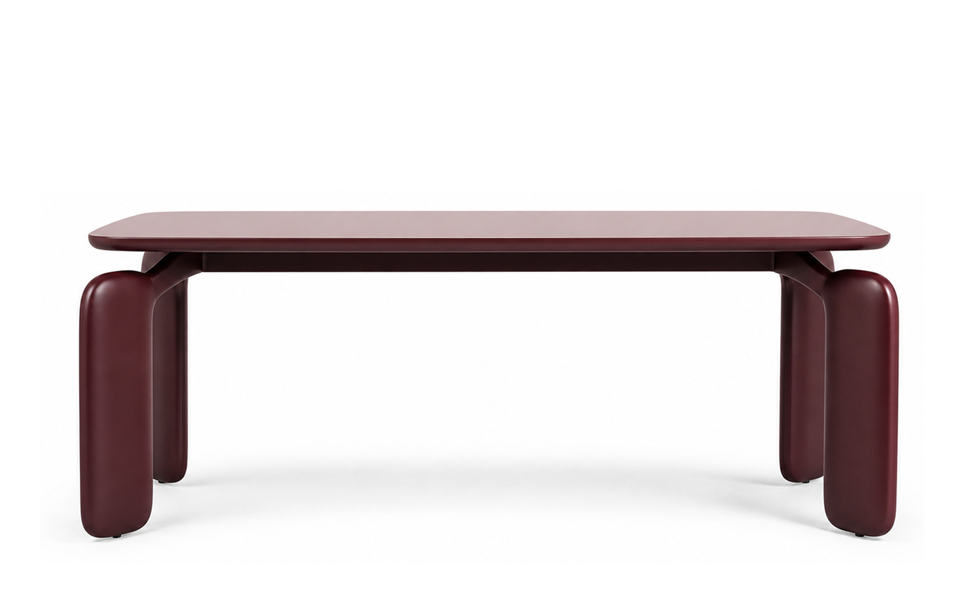 Lacquered timber dining table in deep burgundy with rounded rectangular top and broad curved legs