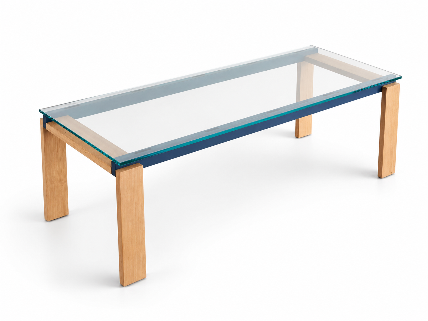 A modern rectangular table with a clear glass top and light natural wood legs, shown on a clean white background.
