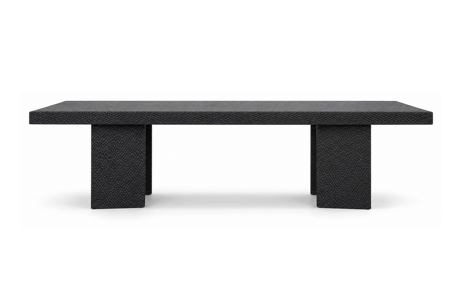Black oak dining table with solid timber top, hand-carved apron and textured slab pedestal legs