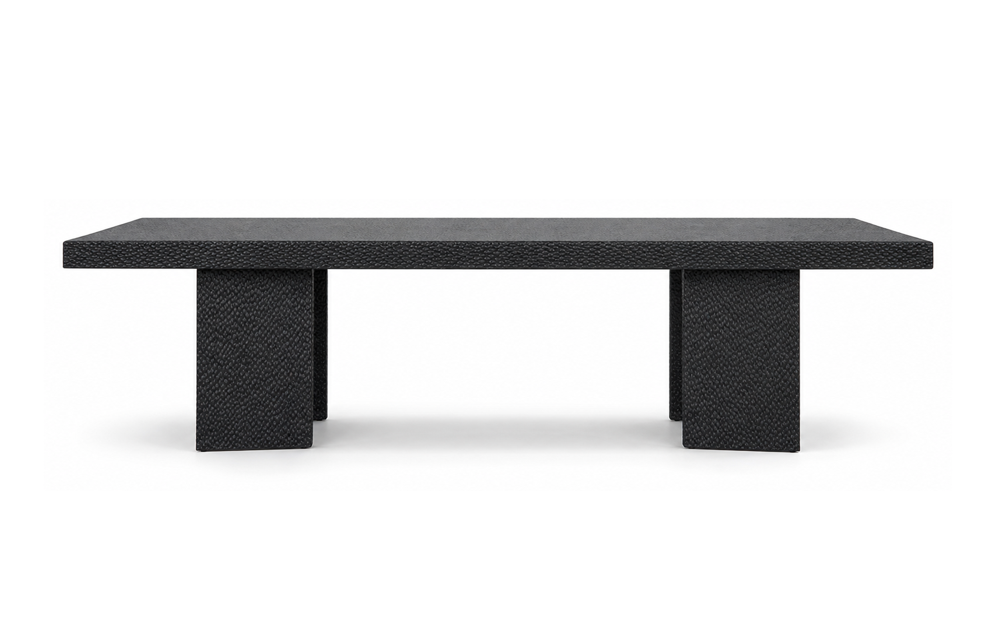 Black oak dining table with solid timber top, hand-carved apron and textured slab pedestal legs